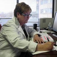 A nurse at Massachusetts General Hospital reviews medical records of a patient. (WBUR file photo)