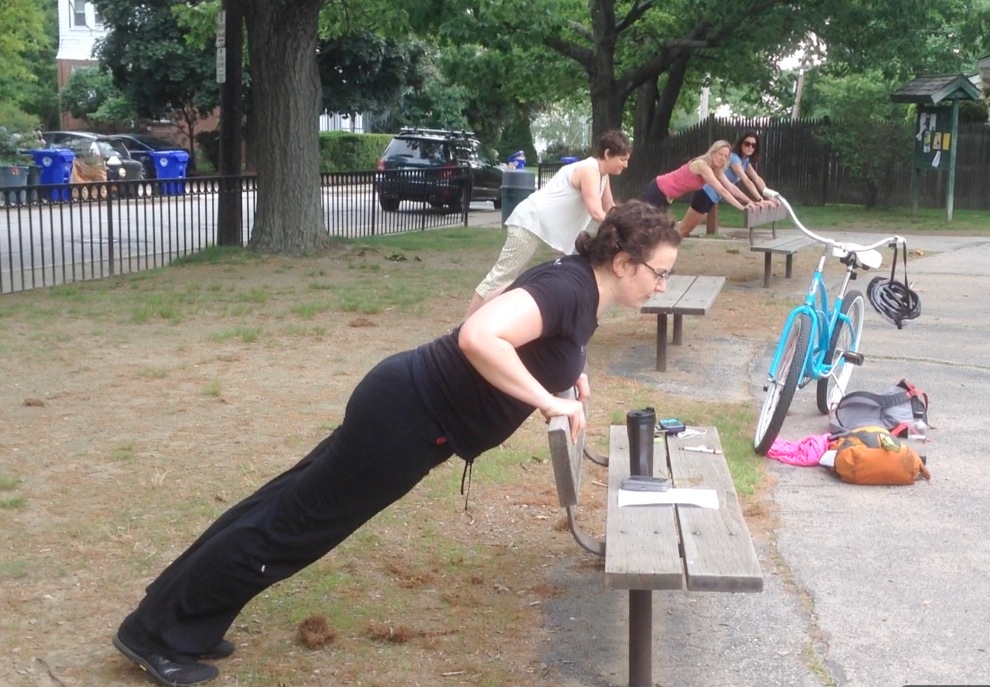 Kat and the models -- all of them, oddly enough, named Beth -- demonstrate an incline pushup on a bench.