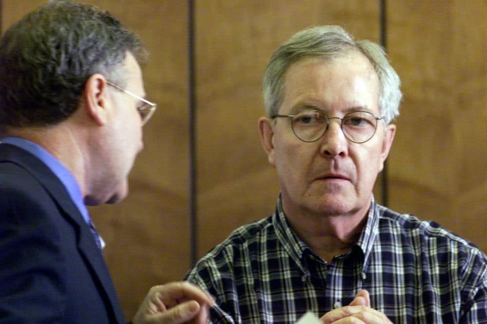 Retired priest Rev. Ronald Paquin, right, talks with his attorney in a 2002 file photo. (Tom Landers/AP, Pool)