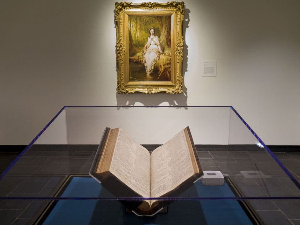 The First Folio is on display at the Mead Art Museum in Amherst College. Hanging on the wall behind is Thomas Dicksee’s "Ophelia." (Andrea Shea/WBUR)