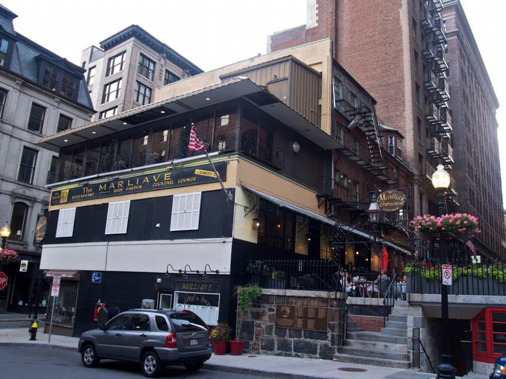 In this 2011 photo, the Marliave restaurant surrounds the Bay State Coin Co. shop. (Patrick Nelson/Flickr)