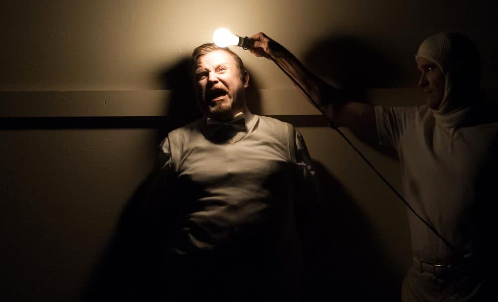 Eric Tucker holding a light to Edmund Wilson in a scene from "What You Will." (Courtesy A.R. Sinclair Photography/Nora Theatre Company)