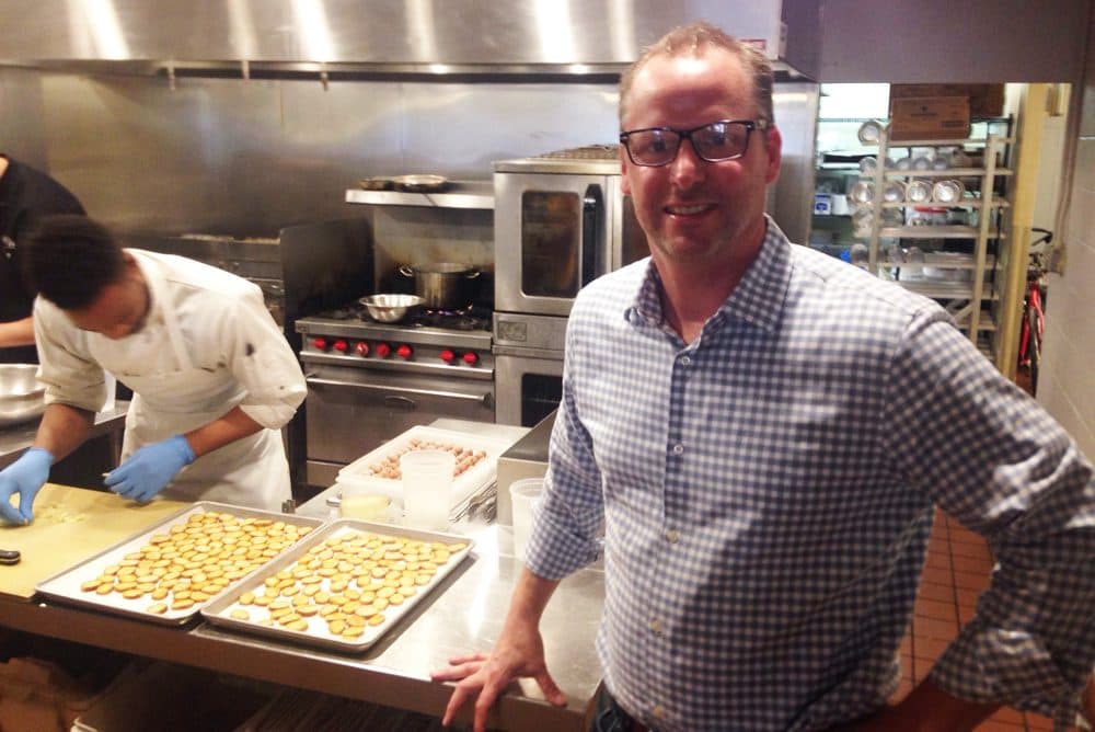 Scott Steenrod, chief operating officer of the Garces Group, stands in the kitchen of Olde Bar in Philadelphia. (Peter O'Dowd/Here & Now)
