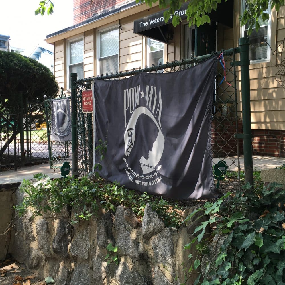 A POW/MIA flag hangs outside The Veterans Group building in Philadelphia. (Alex Ashlock/Here & Now)
