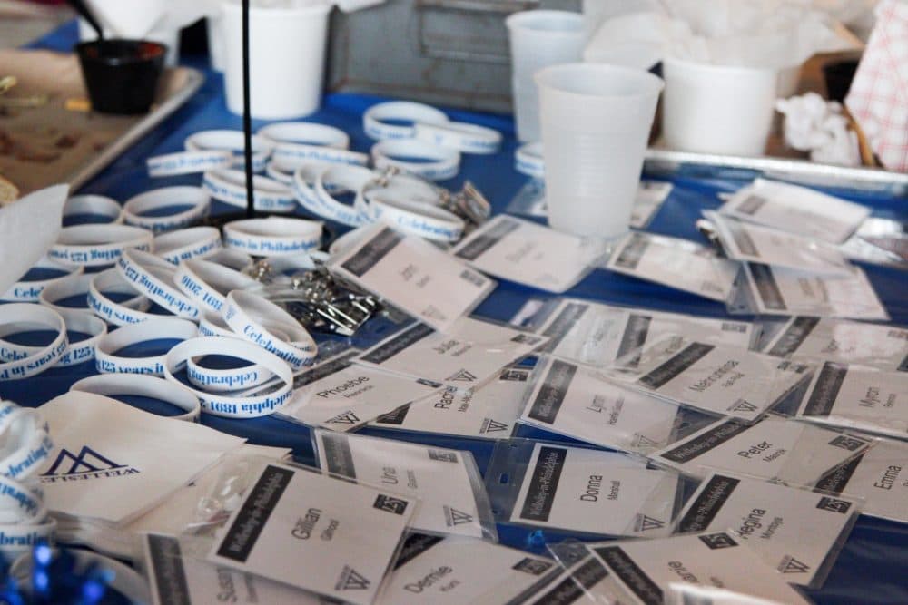 Name tags are spread at a table at the Philadelphia Wellesley College Club during a celebration for Hillary Clinton's nomination. (Samantha Fields/Here & Now)