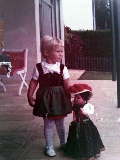 The author, aged 3, in Brazil, dragging along a Bavarian doll and dressed in the dirndl, a traditional German dress, which she wore when her grandparents came to visit. (Author/Courtesy)