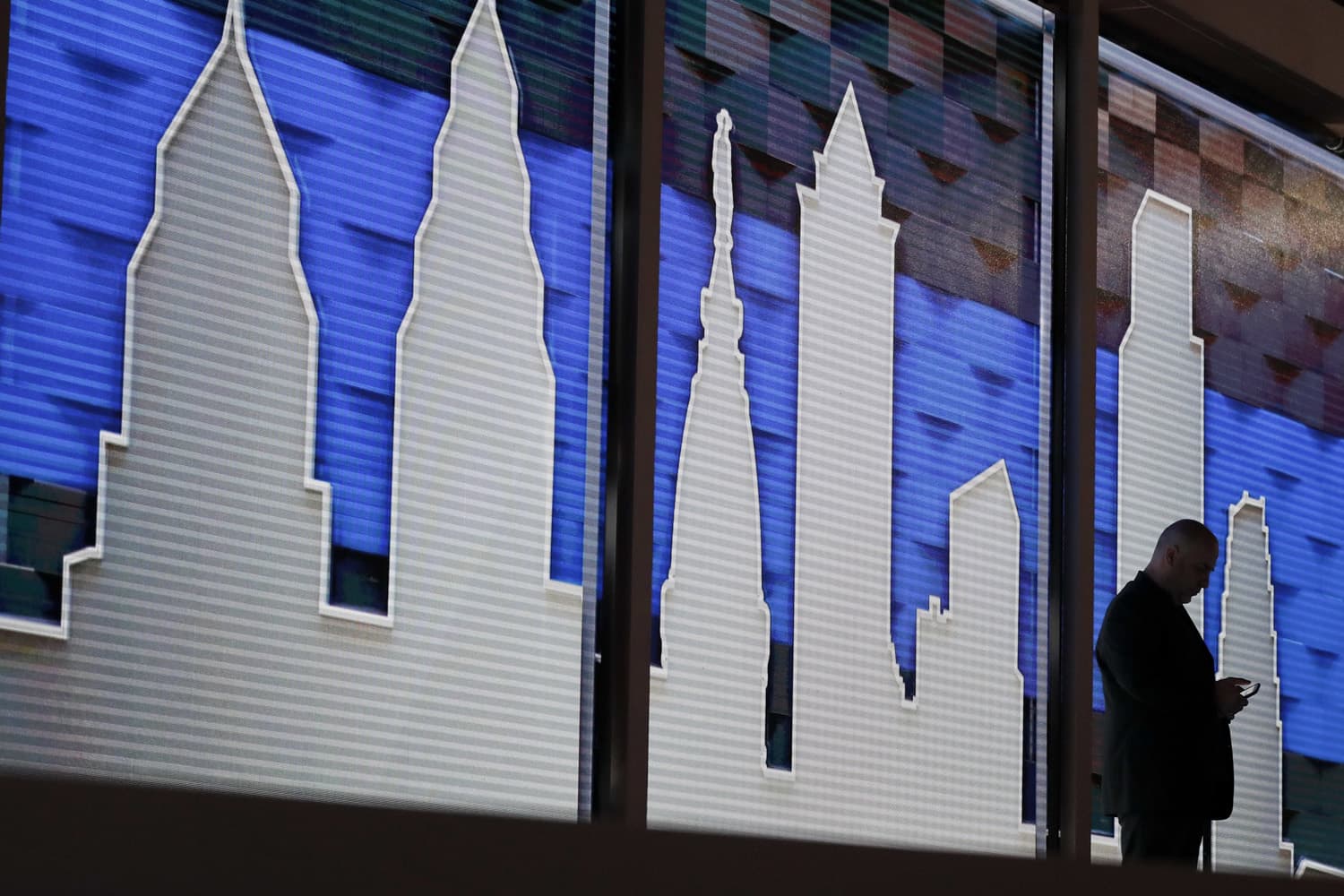 A worker looks at his phone during preparations for the 2016 Democratic National Convention, Friday, July 22, 2016, in Philadelphia. (Matt Slocum/AP)