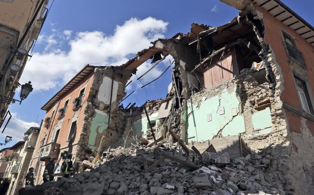 Firefighters search amid the rubbles of a collapsed building in Amatrice Italy on Wednesday. (Alessandra Tarantino/AP)