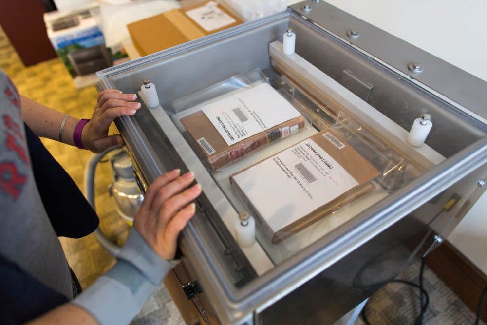 After the case law books are scanned, they are sealed with their original bindings and shipped to Kentucky for storage. (Brooks Kraft/Harvard Law School)