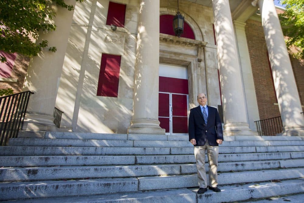 Marc Dohan, executive director NewVue Communities, stands in front of the vacant B. F. Brown School which NewVue plans to renovate into artist apartments. (Jesse Costa/WBUR)