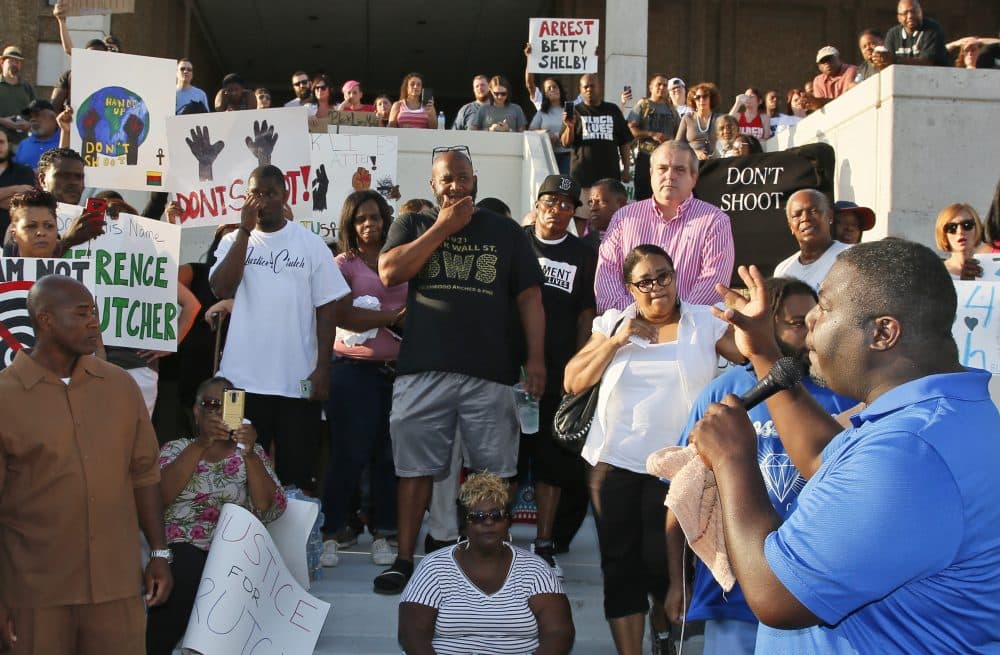 Marq Lewis, right, of We The People Oklahoma, stresses that the "protest for justice" over Friday's shooting death of Terence Crutcher, sponsored by We the People Oklahoma, will remain peaceful, in Tulsa, Okla., on Tuesday. (Sue Ogrocki/AP)