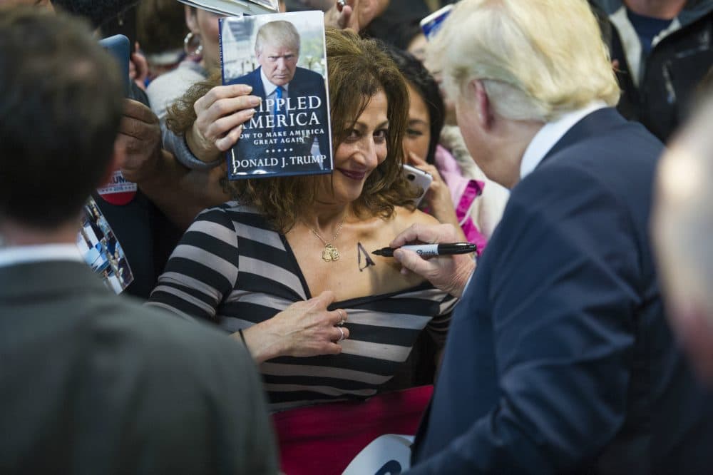 Donald Trump autographs a supporter's chest at a campaign rally at Prince William County Fair Grounds, Dec. 2, 2015, in Manassas, Va. (Cliff Owen/AP)