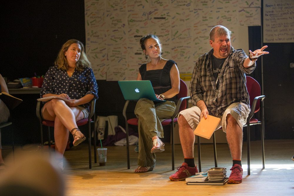 David Gammons kicks off his workshop by asking teachers to offer an image that evokes "Hamlet" for them. With him are Mara Sidmore of Actors' Shakespeare Project, center, and Kelly Ryll, an instructional coach with the Department of Youth Services. (Jesse Costa/WBUR)
