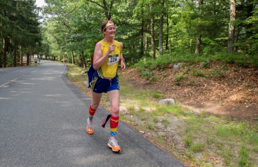 Carol Chaoui runs a race in Brockton in July. "Since I can no longer run fast," she says, "I am usually in a Wonder Woman costume!" (Courtesy of the author)