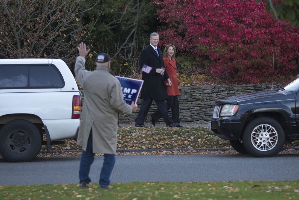 Charlie and Lauren Baker walk to the polls in Swampscott on Tuesday morning. (Jesse Costa/WBUR)