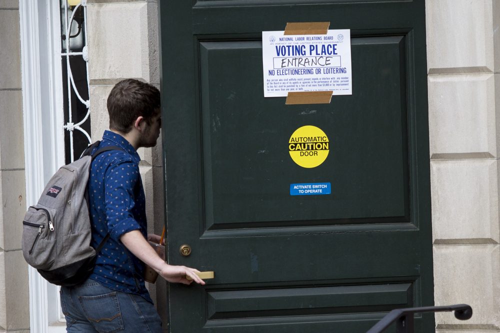 A student enters Phillips Brooks House in Harvard Yard to vote. (Jesse Costa/WBUR)