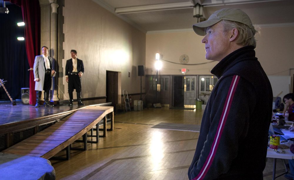 Burrows watches a rehearsal a couple days before "The Tempest" begins in Brookline. (Robin Lubbock/WBUR)
