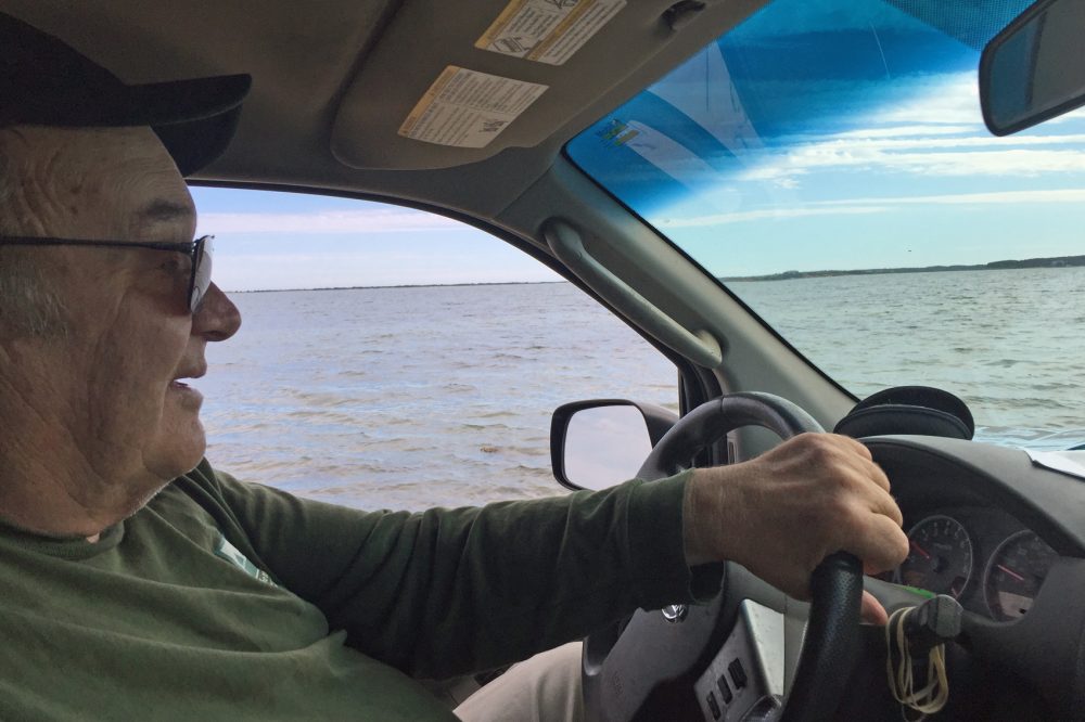 Angler Paul Schultz behind the wheel. (Robin Young/Here & Now)