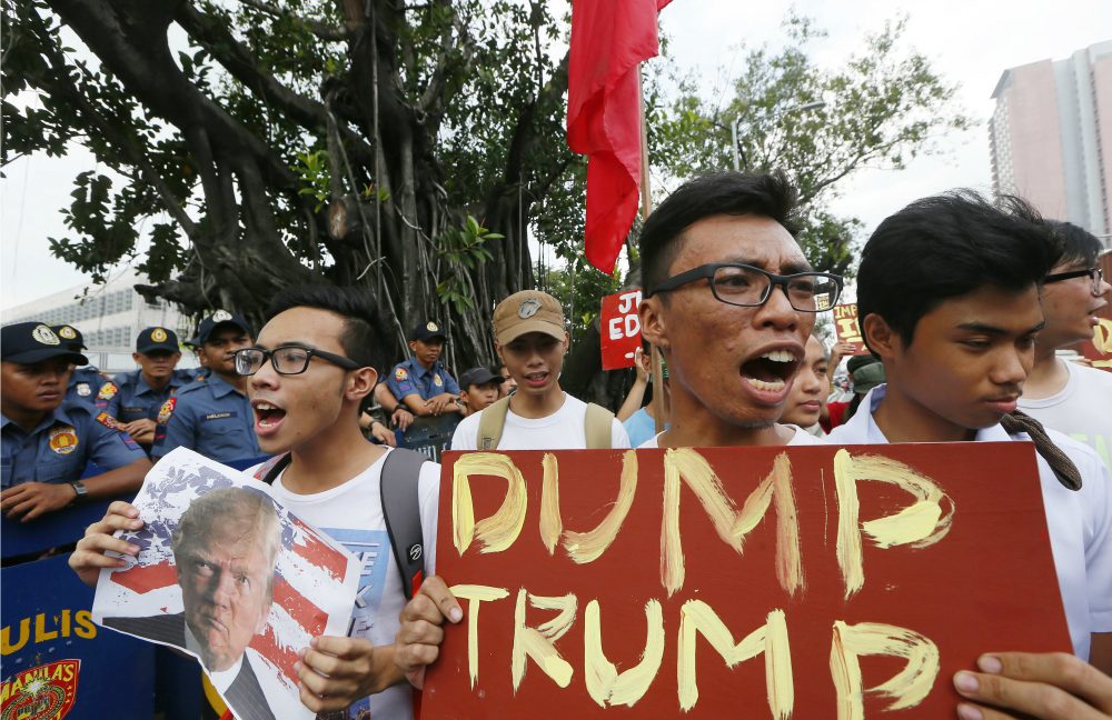 Filipino protesters shout slogans to denounce the election of U.S. President-elect Donald Trump in an anti-U.S. protest at the US Embassy in Manila, Philippines Thursday, Nov. 10, 2016 in Manila, Philippines. (Bullit Marquez/AP)