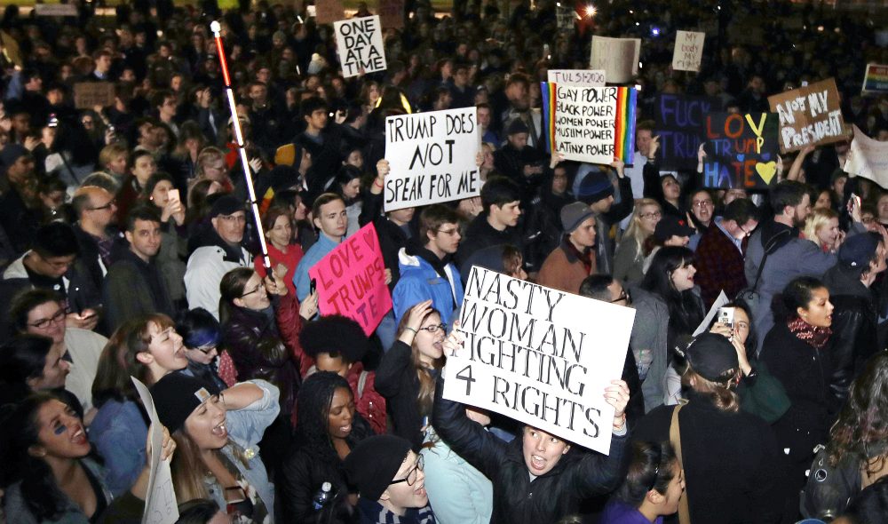 Hundreds protest in opposition of Donald Trump's presidential election victory on Boston Common in Boston, Wednesday evening, Nov. 9, 2016. (Charles Krupa/AP)