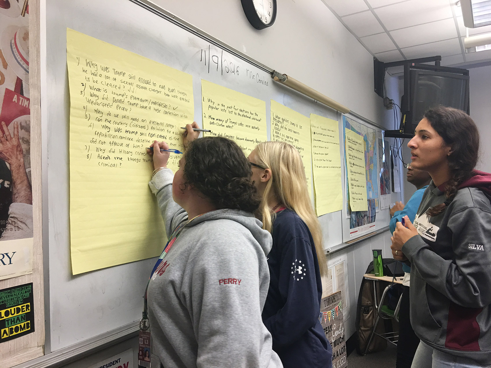 Lowell High School students transcribe their remaining election questions. (Tonya Mosley/WBUR)
