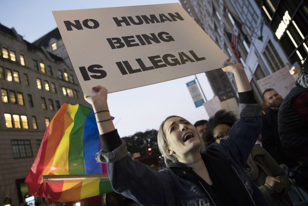 Acacia Handel holds a sign during a demonstration outside Trump Tower in New York on Saturday, Nov. 12, 2016, to protest against President-elect Donald Trump. (Mary Altaffer/AP)