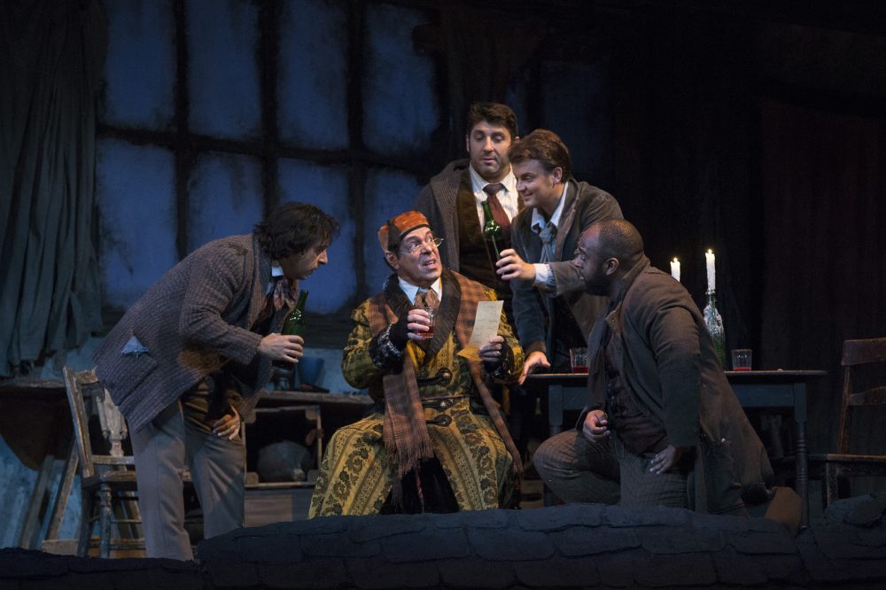 Rodion Pogossov as Schaunard, Philip Cokorinos as Benoit, David Bizic as Marcello, Dmytro Popov as Rodolfo and Ryan Speedo Green as Colline in Puccini's La Bohème. (Courtesy Marty Sohl/Metropolitan Opera)