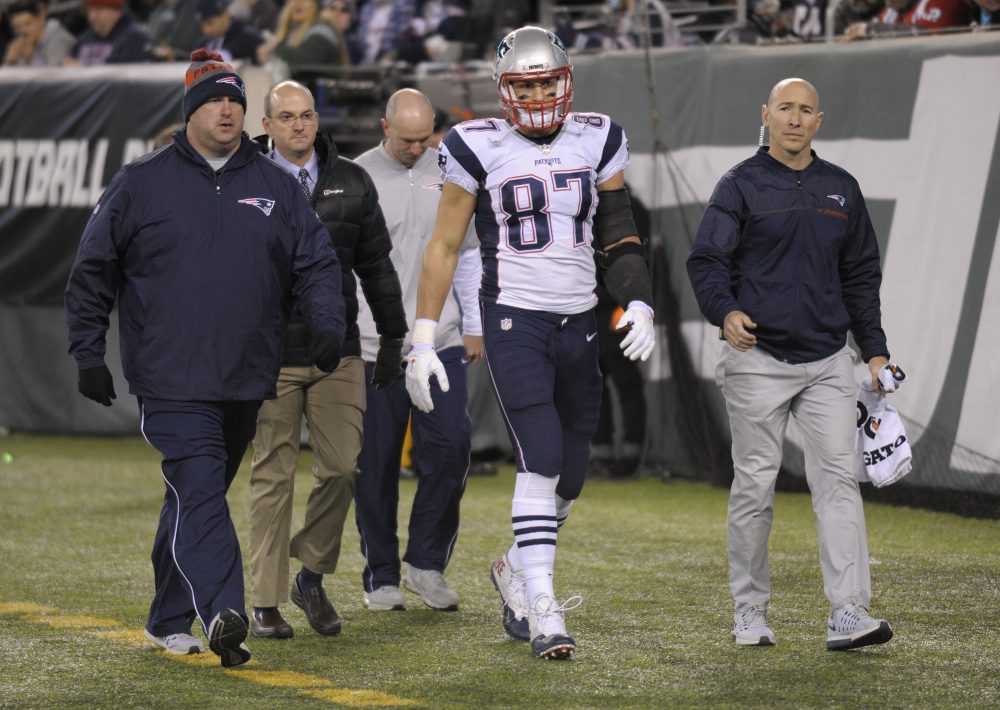 Patriots tight end Rob Gronkowski walks off the field with an injury during the second quarter of the Nov. 27 game against the Jets. (Bill Kostroun/AP)