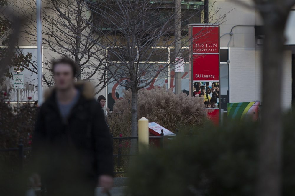 A man walks on Commonwealth Avenue from Kenmore Squre at Boston University. (Jesse Costa/WBUR)