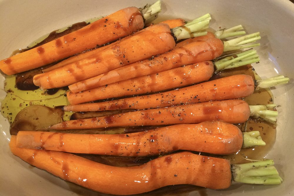 Kathy's roasted carrots with pomegranate, molasses and maple syrup glaze and pomegranate seeds. (Kathy Gunst for Here & Now)