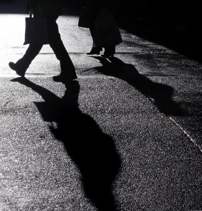 Holiday shoppers carry packages at Downtown Crossing in Boston on Dec. 22, 2009. (Charles Krupa/AP)