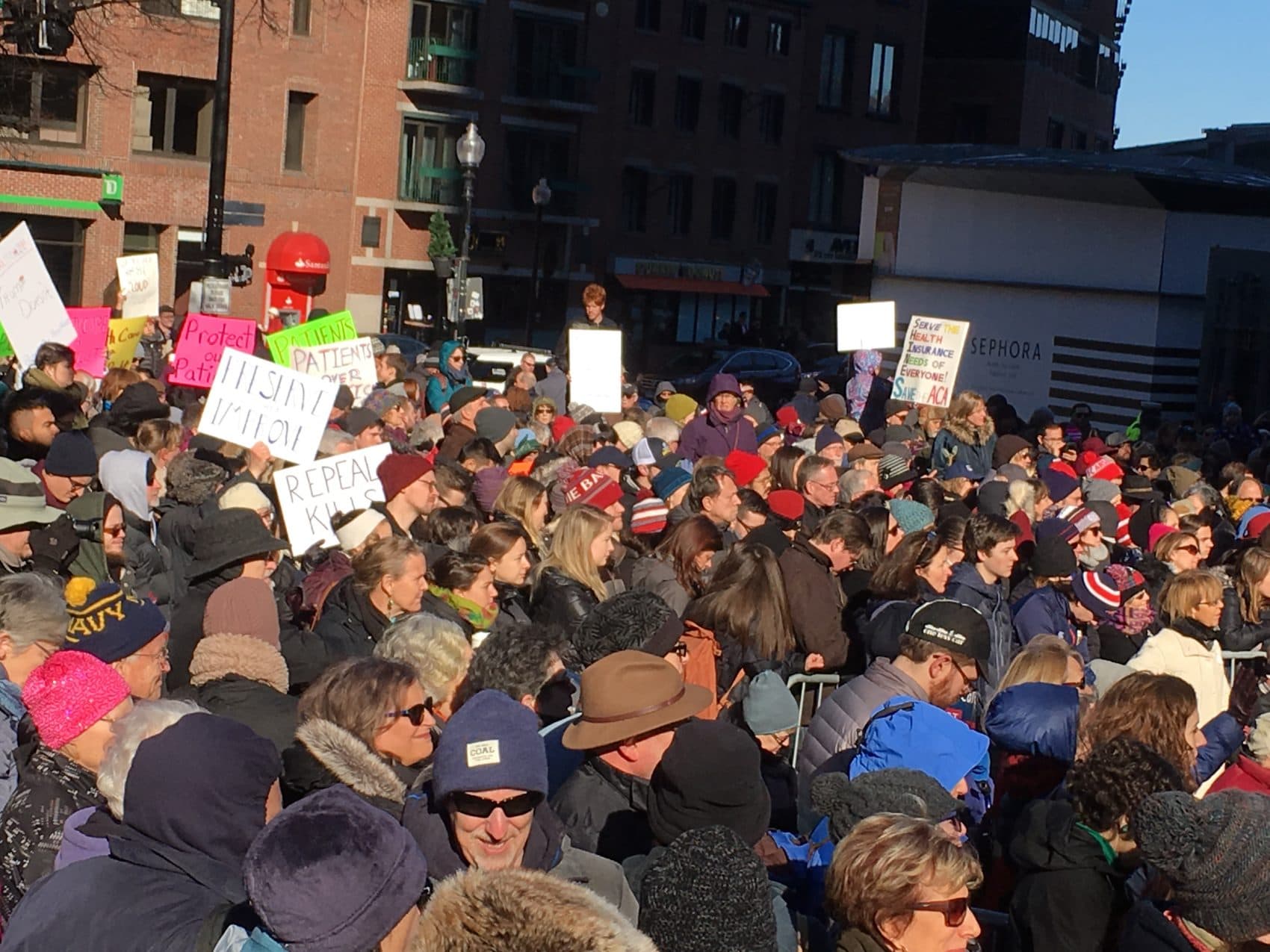 Supporters of the Affordable Care Act rally at Faneuil Hall Sunday. (Qainat Khan/WBUR)