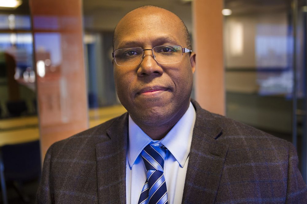 Dr. Christoper Lathan, a Dana-Farber oncologist and cancer researcher, says poor adults are more likely to get cancer. "Not only are you more likely to get cancers, you're less likely to go to the physician to have your cancer treated. And then, unfortunately, you're more likely to die earlier from your cancer -- just based on income." (Jesse Costa/WBUR)