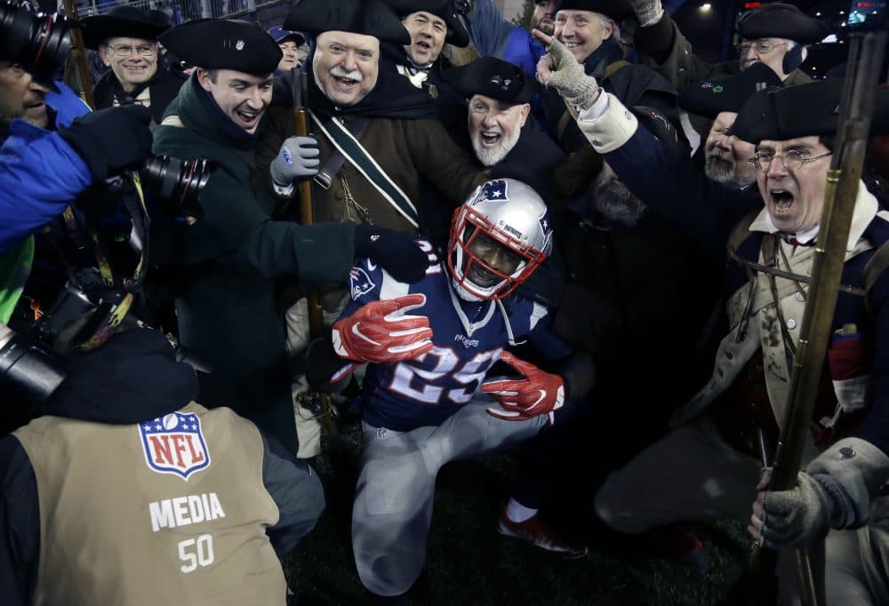 Patriots running back LeGarrette Blount celebrates a touchdown with the End Zone Militia during the second half of this year's AFC championship. (Elise Amendola/AP)