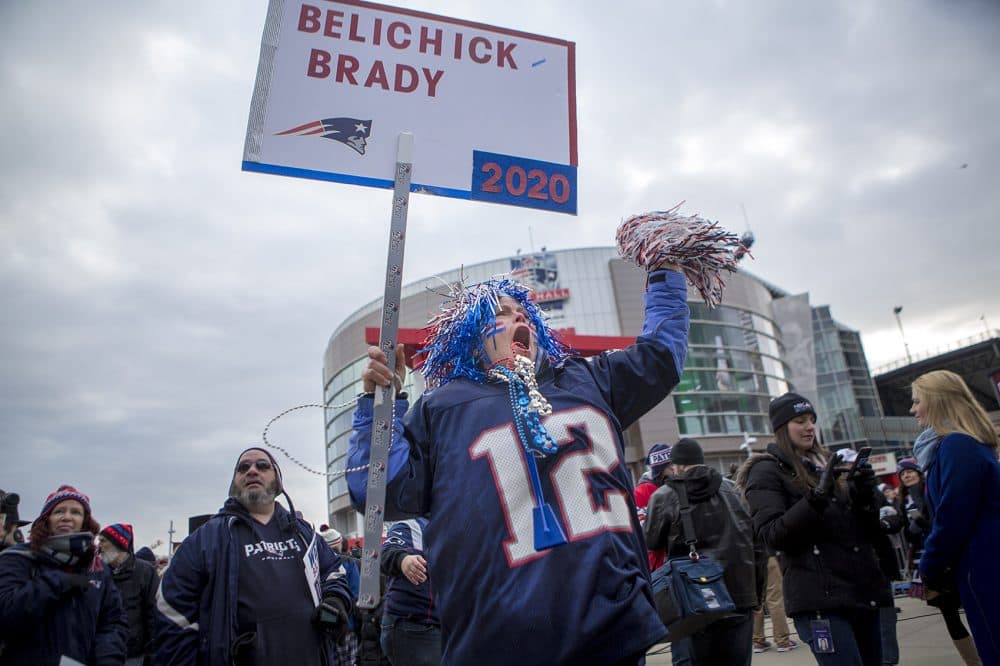 Sandra Balfe of Wrentham sports red, white and blue hair and beads. (Jesse Costa/WBUR)