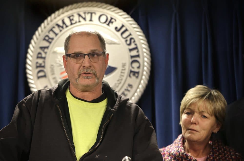 Scott McCloskey, son of 69-year-old murder victim Philip McCloskey, faces reporters as Mary Rizzo, mother of 19-year-old murder victim Jonathan Rizzo, looks on during a news conference at Boston federal court Monday. (Steven Senne/AP)