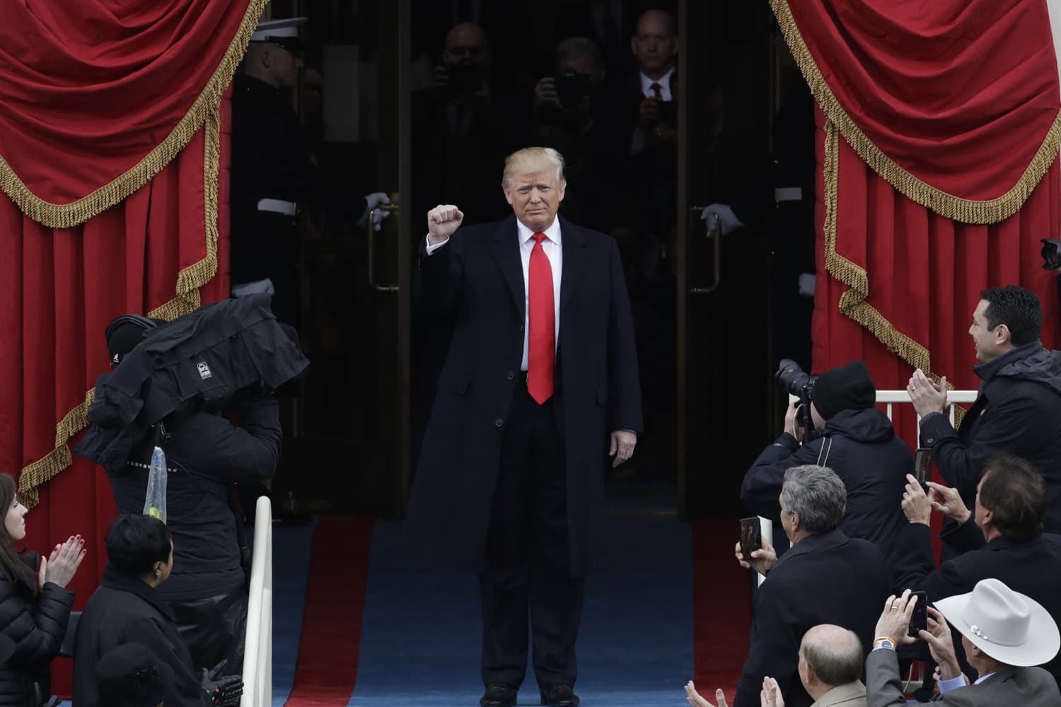 President Donald Trump pumps his fist as he arrives at his swearing-in ceremony on Capitol Hill in Washington, D.C. (Patrick Semansky/AP)