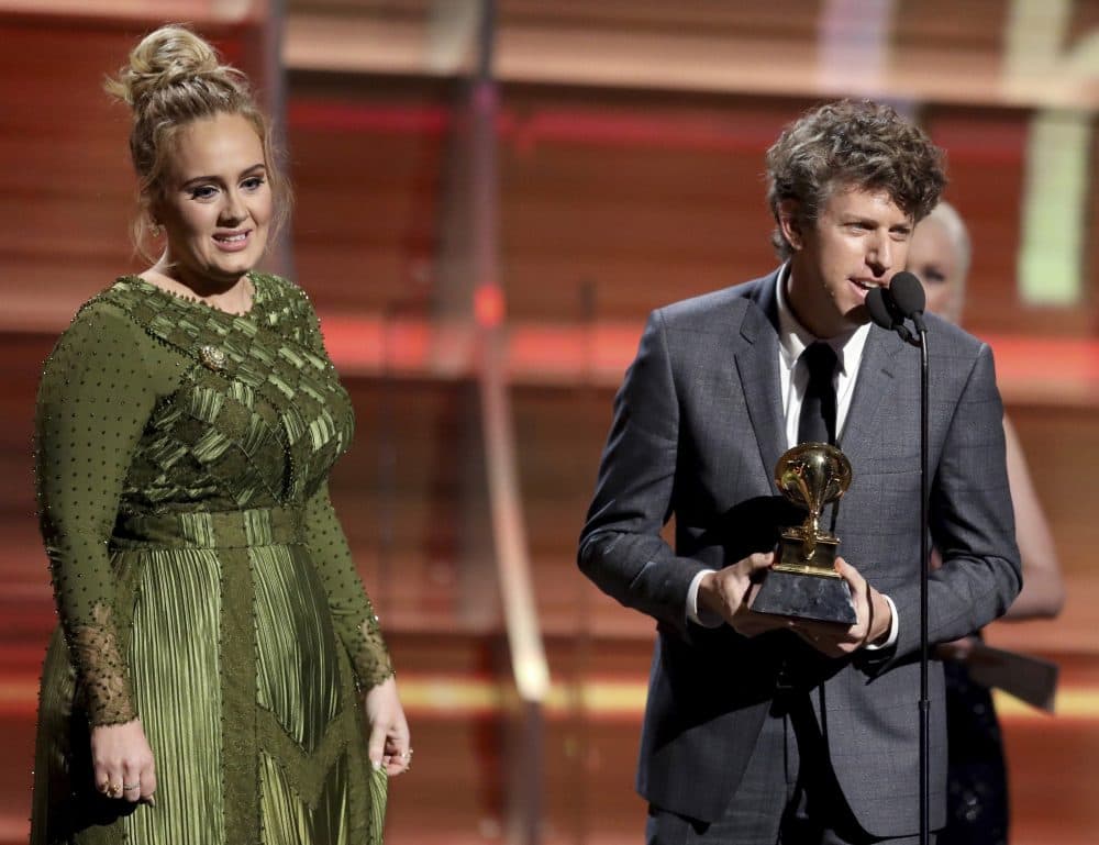 Greg Kurstin, right, and Adele accept the award for song of the year for "Hello." (Matt Sayles/Invision/AP)