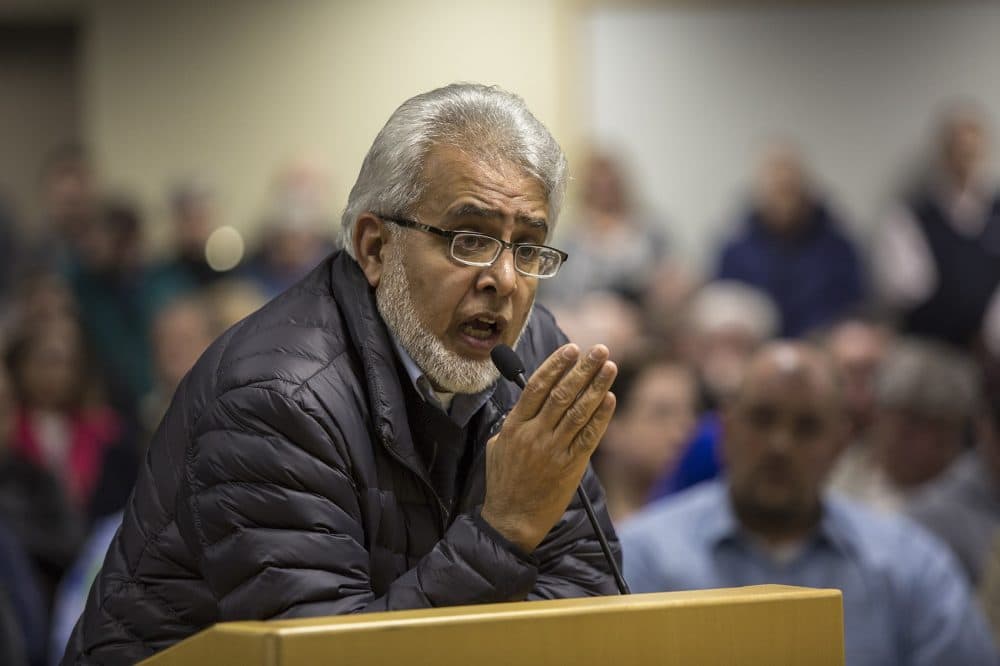 In this February 2016 file photo, Dr. Khalid Khan Sadozai answers questions from the Dudley Board of Selectmen. (Jesse Costa/WBUR)