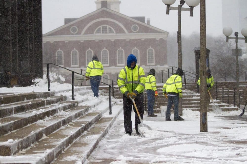 Workers cleared the steps at City Hall. (Jesse Costa/WBUR)