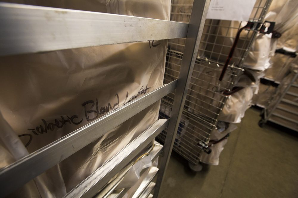 Prepared meals on this cart are for people who are diabetic and require bland and low-fat meals. It's just one of several carts inside a walk-in refrigerator loaded with prepared meals to meet clients' many different dietary needs. (Jesse Costa/WBUR)