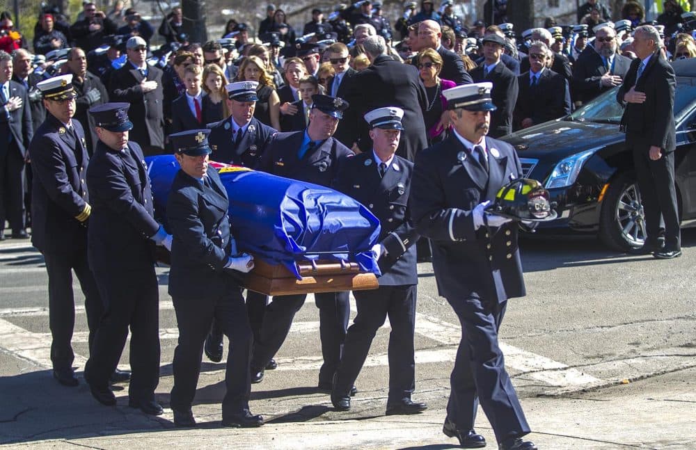 Joseph Toscano's casket is carried into St. Patrick's Church in Watertown. (Jesse Costa/WBUR)