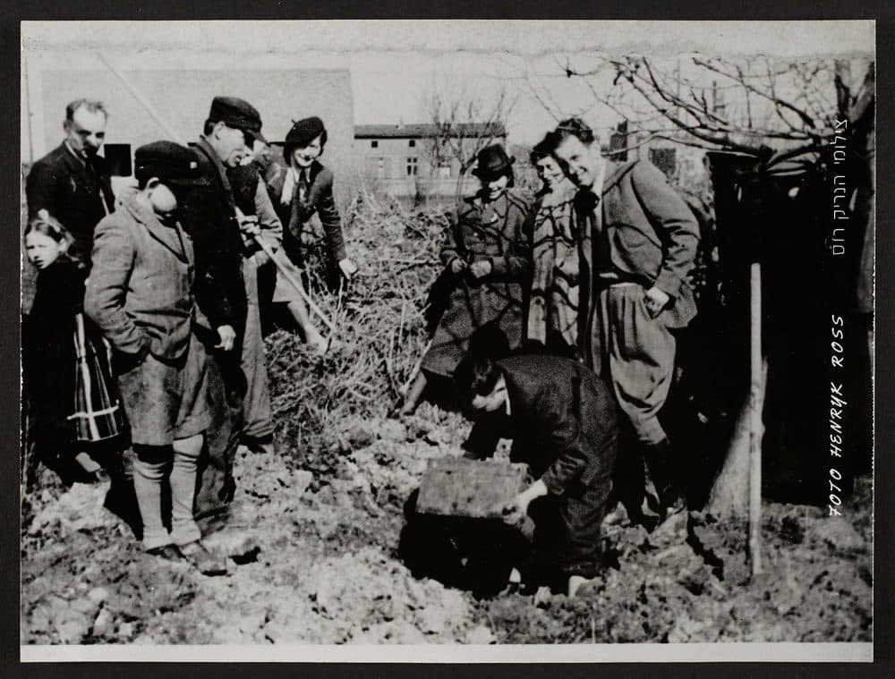 Henryk Ross excavating his hidden box of negatives and documents from the Lodz Ghetto in 1945. (Courtesy, Museum of Fine Arts, Boston)
