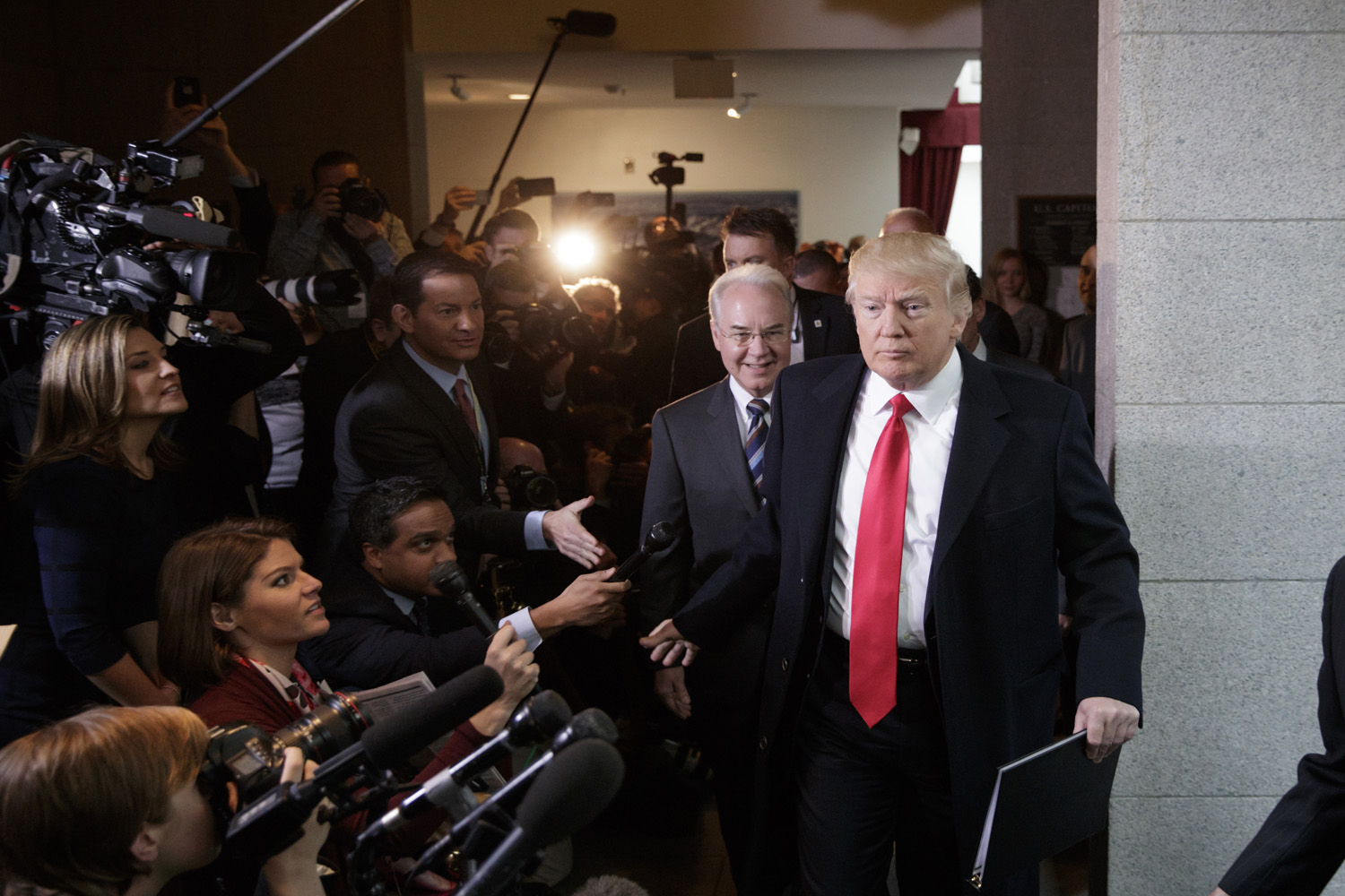 President Donald Trump, with Health and Human Services Secretary Tom Price, arrives at the Capitol to rally support for the Republican health care overhaul by taking his case directly to GOP lawmakers.(AP/J. Scott Applewhite)