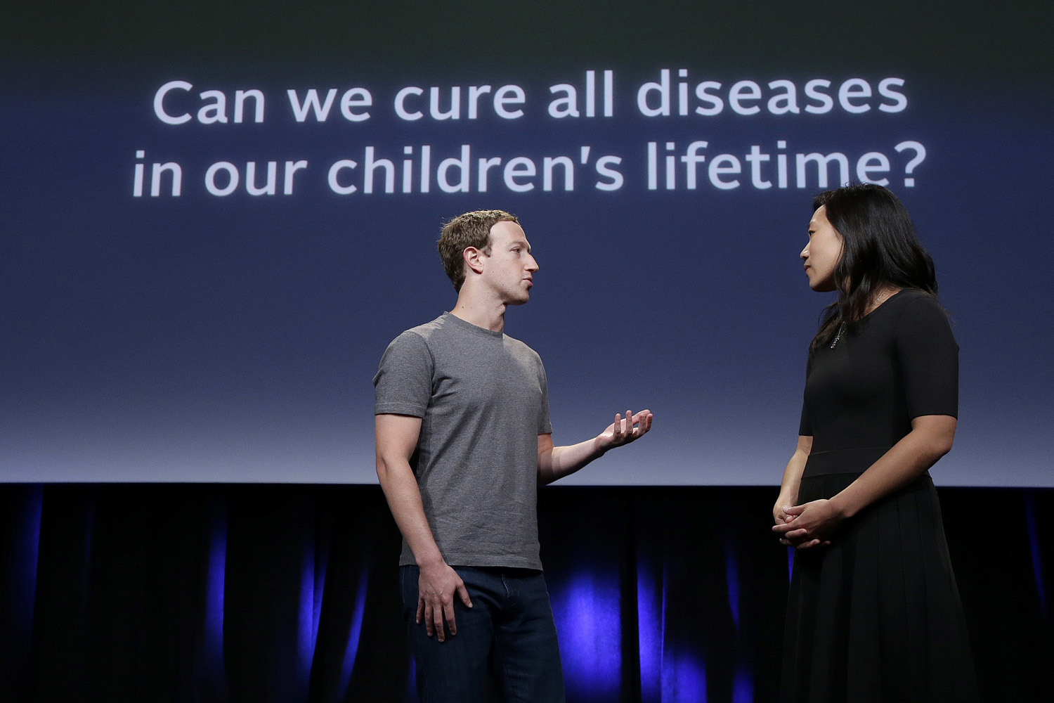 In this Tuesday, Sept. 20, 2016, photo, Facebook CEO Mark Zuckerberg speaks with his wife, Priscilla Chan, as they prepare for a presentation in San Francisco. (Jeff Chiu/AP)