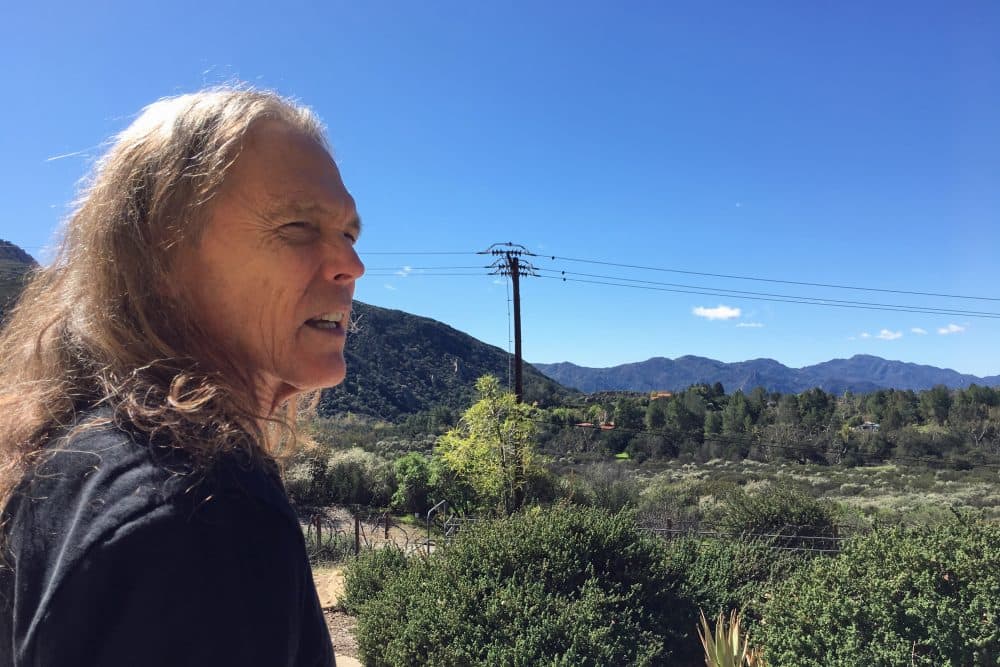 Schmit outside his home in California's Santa Monica Mountains. (Robin Young/Here & Now)