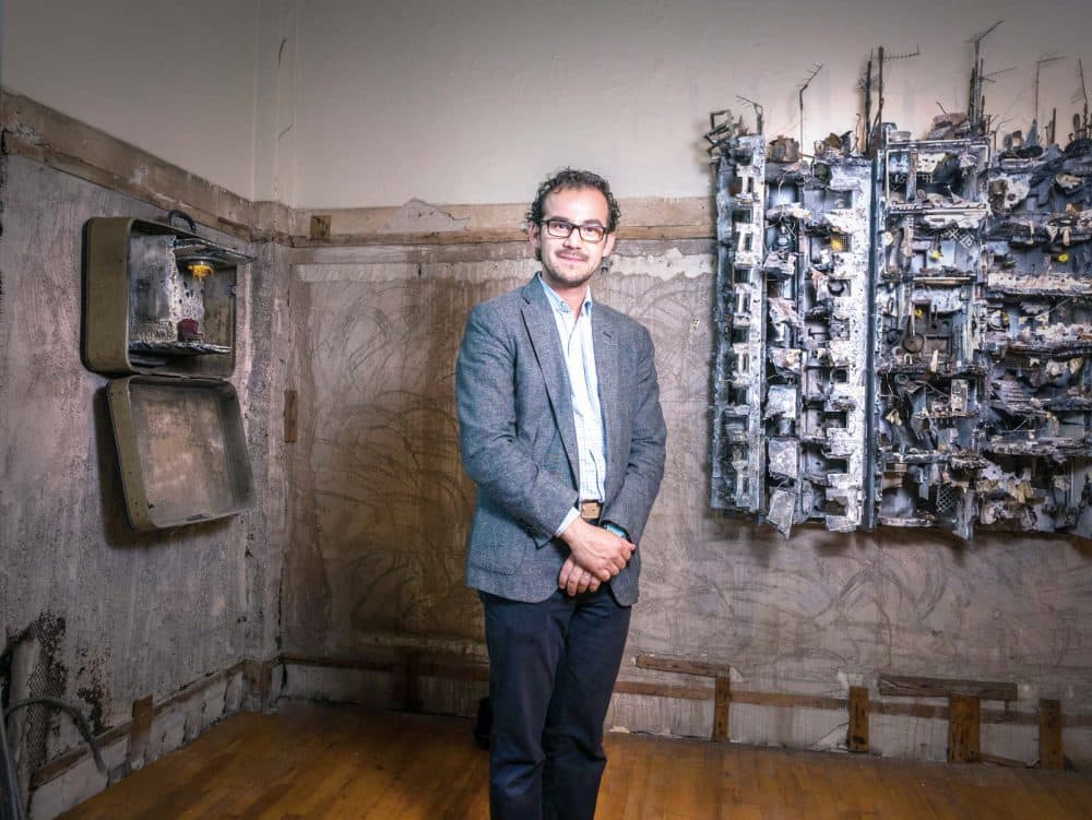 Artist Mohamad Hafez stands with his work "We Have Won!" (Charlee Marin, courtesy of Mohamad Hafez)