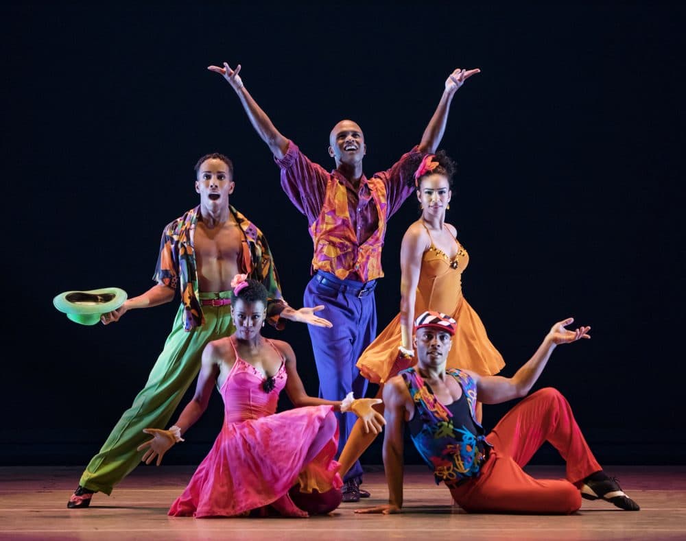 Alvin Ailey dancers, including Belen Pereyra in the orange dress on the right, perform "The Winter in Lisbon." They'll be performing the same program in Boston on their spring tour. (Courtesy Paul Kolnik)