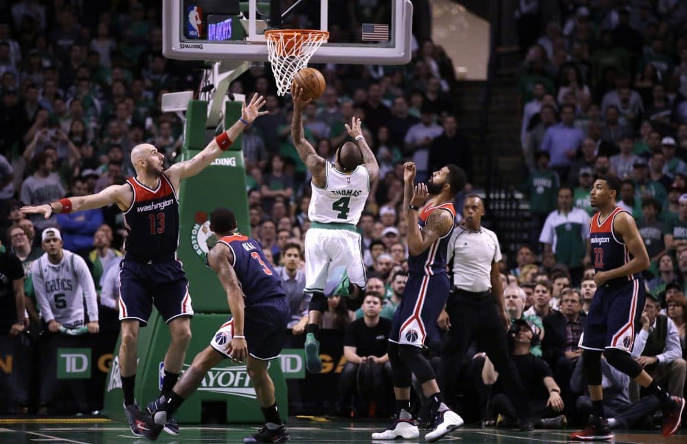 Thomas drives to the basket during the second half of a second-round NBA playoff series basketball game in Boston on May 2. The Celtics defeated the Wizards 129-119 in overtime. (Charles Krupa/AP)