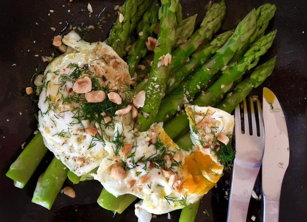 Kathy 's steamed asparagus with fried eggs, brown butter and a dill-lemon sauce. (Kathy Gunst for Here & Now)